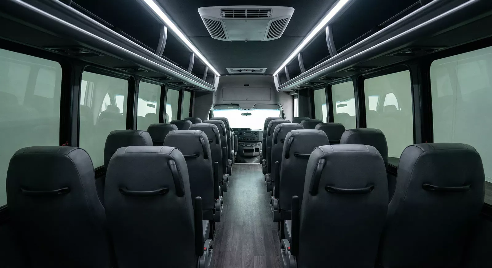 28 Passenger Coach Bus interior — Denver Party Ride fleet (26–28 passengers)