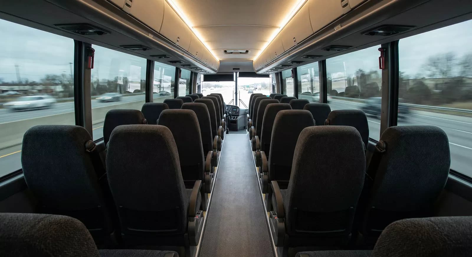 48 Passenger Coach Bus interior — Denver Party Ride fleet (46–48 passengers)